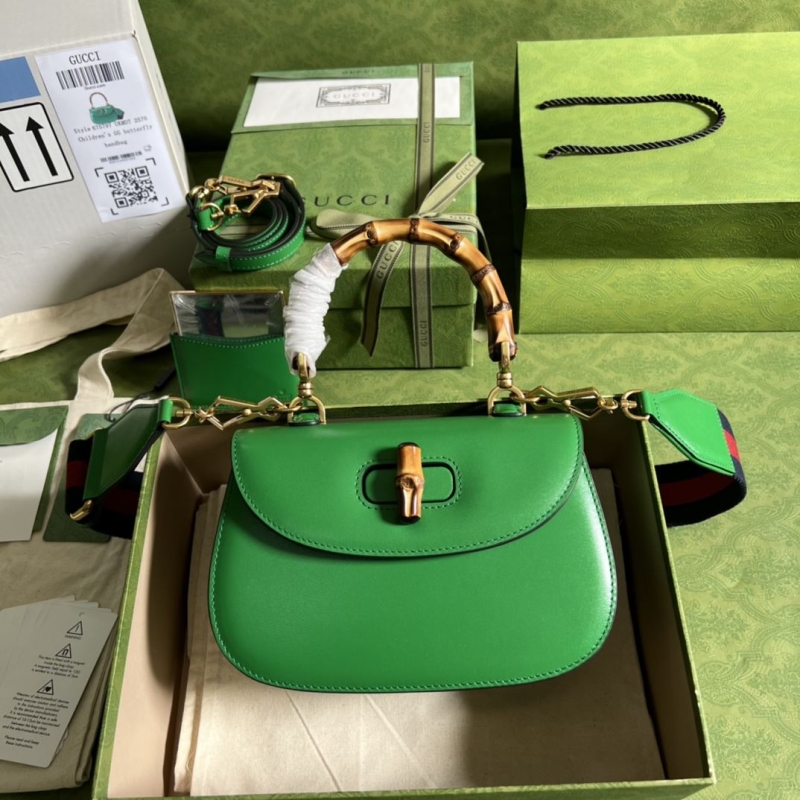 G*u*i top handle bags